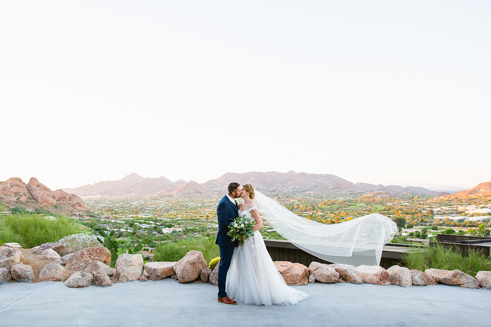 Bride & Groom pose for their Sanctuary at Camelback wedding by Phoenix wedding photographer Juniper and Co Photography.