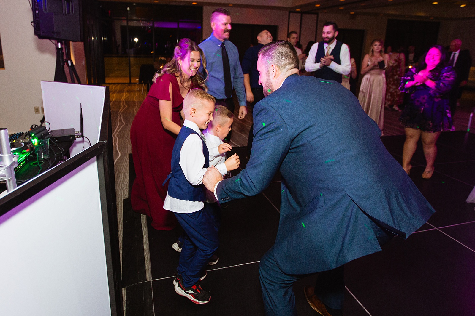 Groom dancing with guests at Sanctuary at Camelback wedding reception by Phoenix wedding photographer Juniper and Co Photography.
