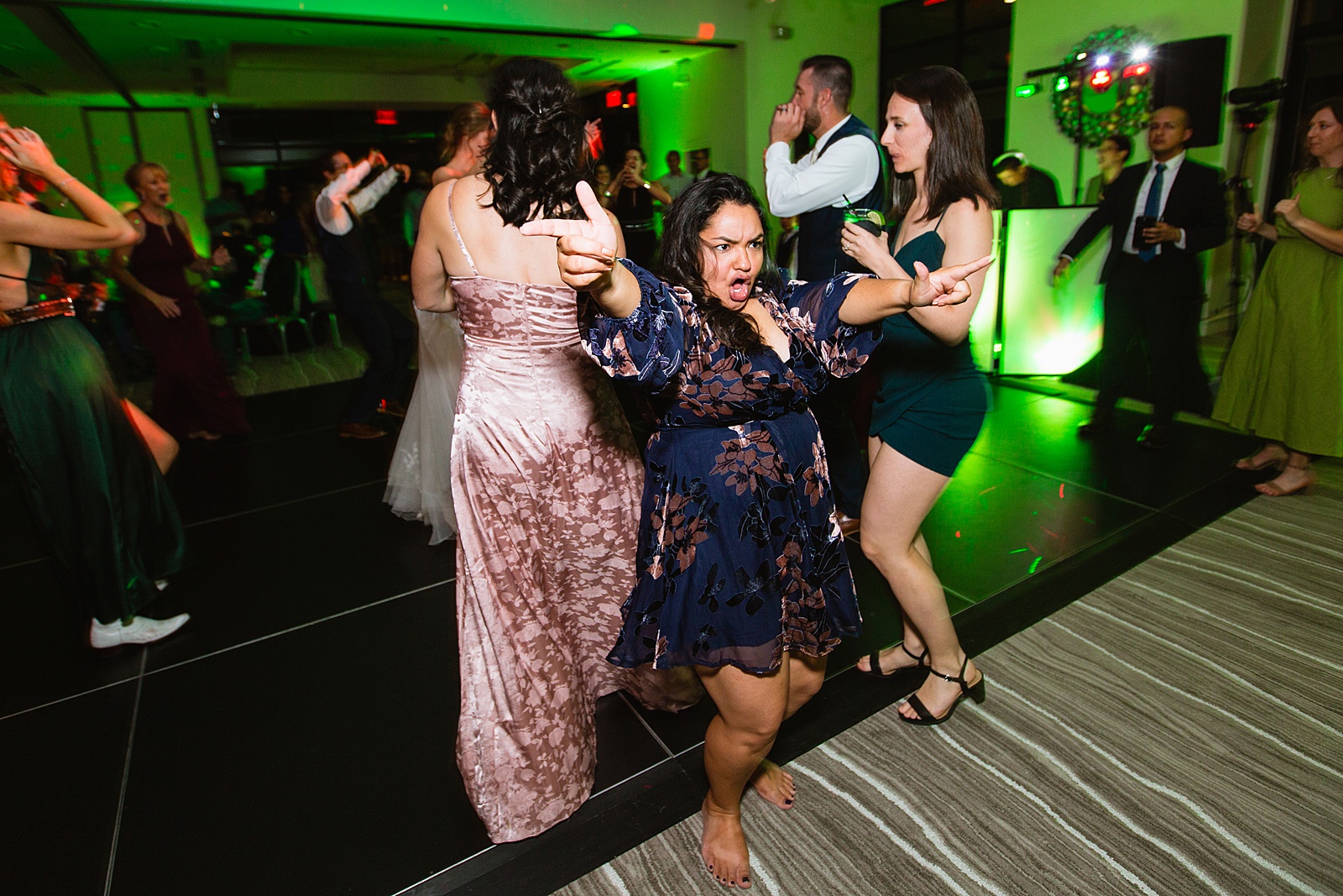Guests dancing together at Sanctuary at Camelback wedding reception by Phoenix wedding photographer Juniper and Co Photography.