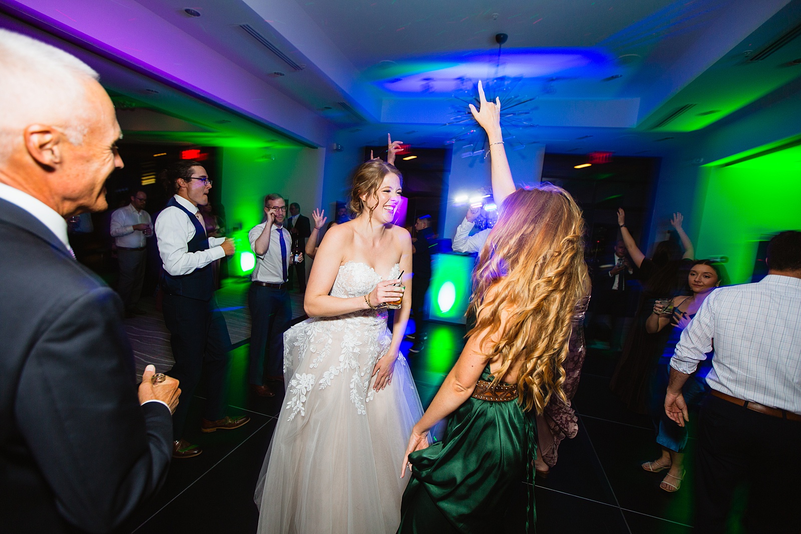 Bride dancing with guests at Sanctuary at Camelback wedding reception by Phoenix wedding photographer Juniper and Co Photography.
