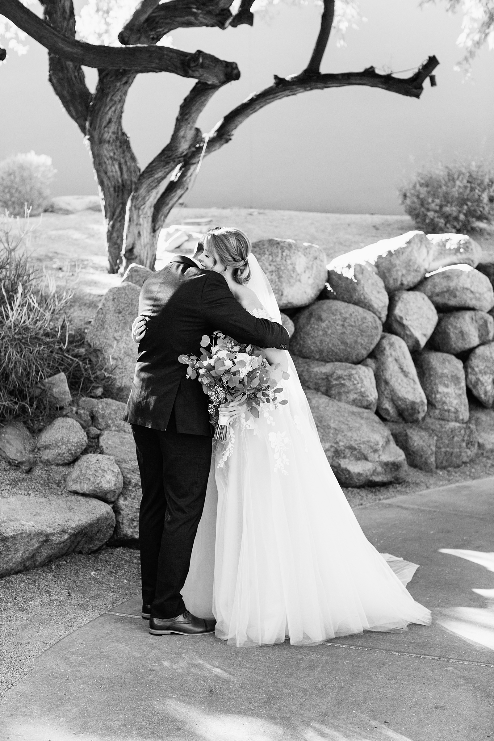 Bride & Groom share an intimate moment during their first look at Sanctuary at Camelback by Phoenix wedding photographer Juniper and Co Photography.