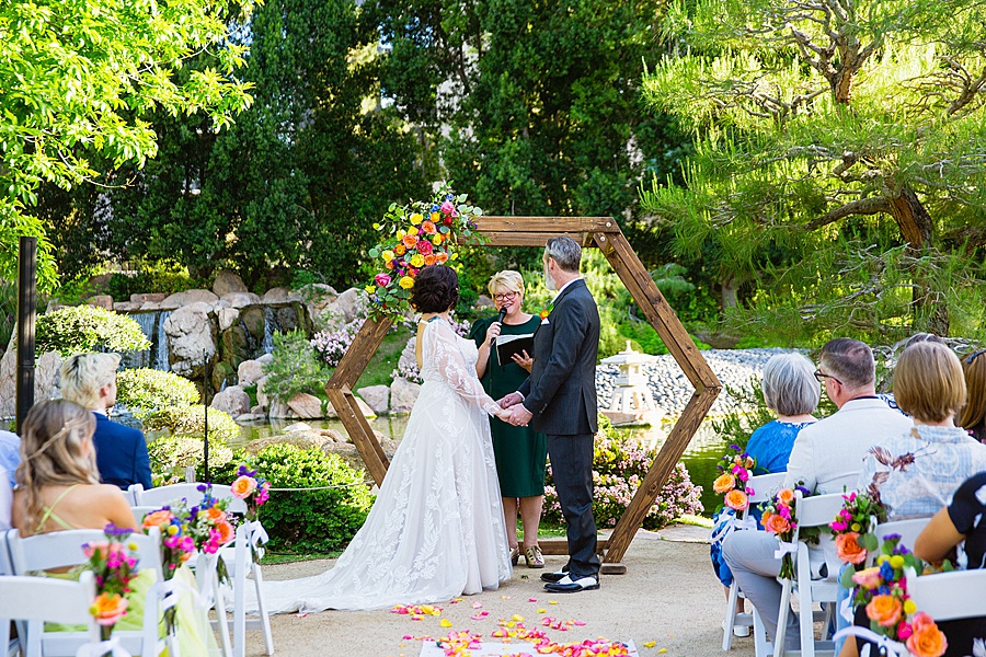 Bride and groom stand at the alter during an intimate wedding at the Japanese Friendship Garden in Phoenix AZ by Juniper & Co Photo.