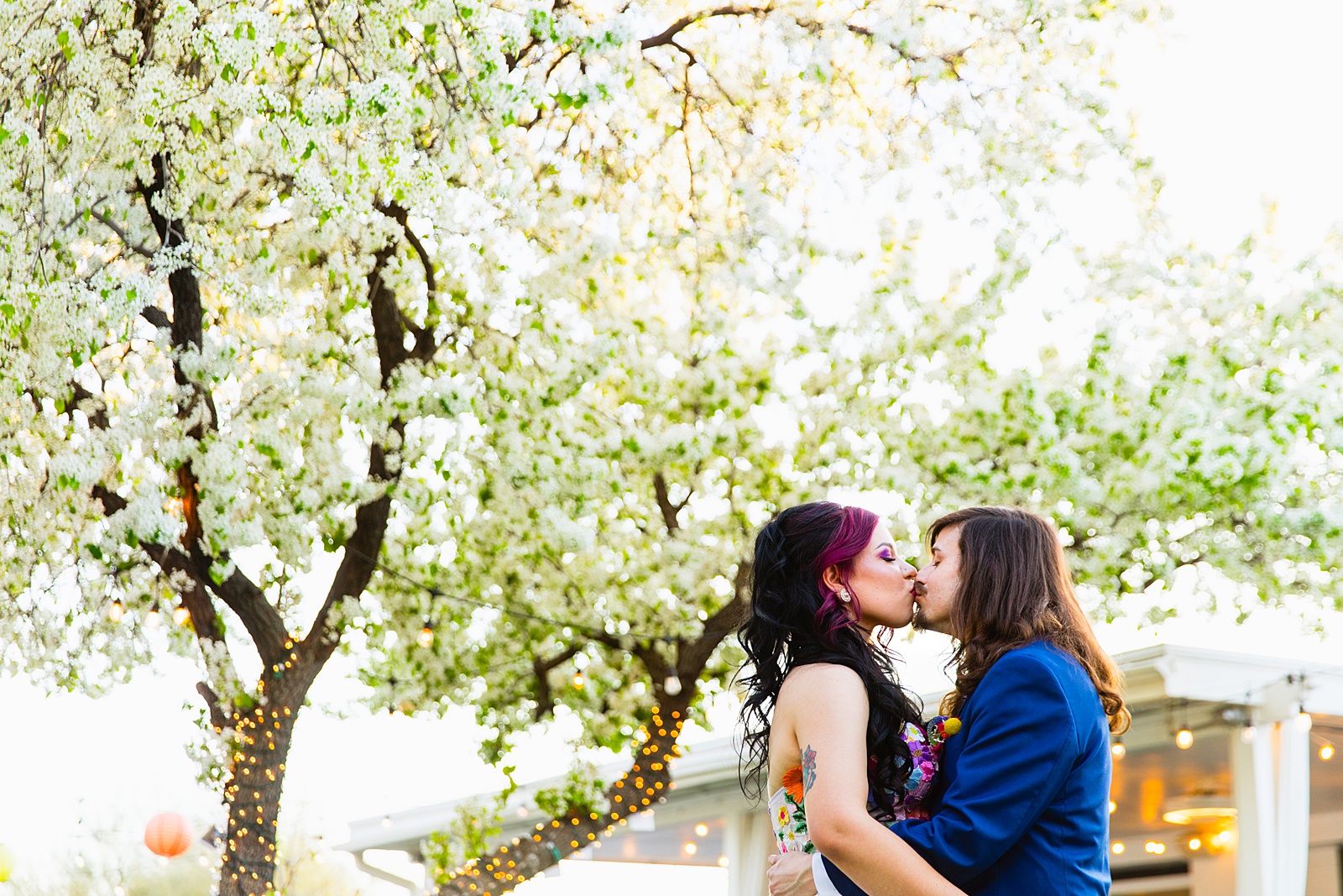 Bride & Groom share a kiss during their The Cottage wedding by Gilbert wedding photographer Juniper and Co Photography.